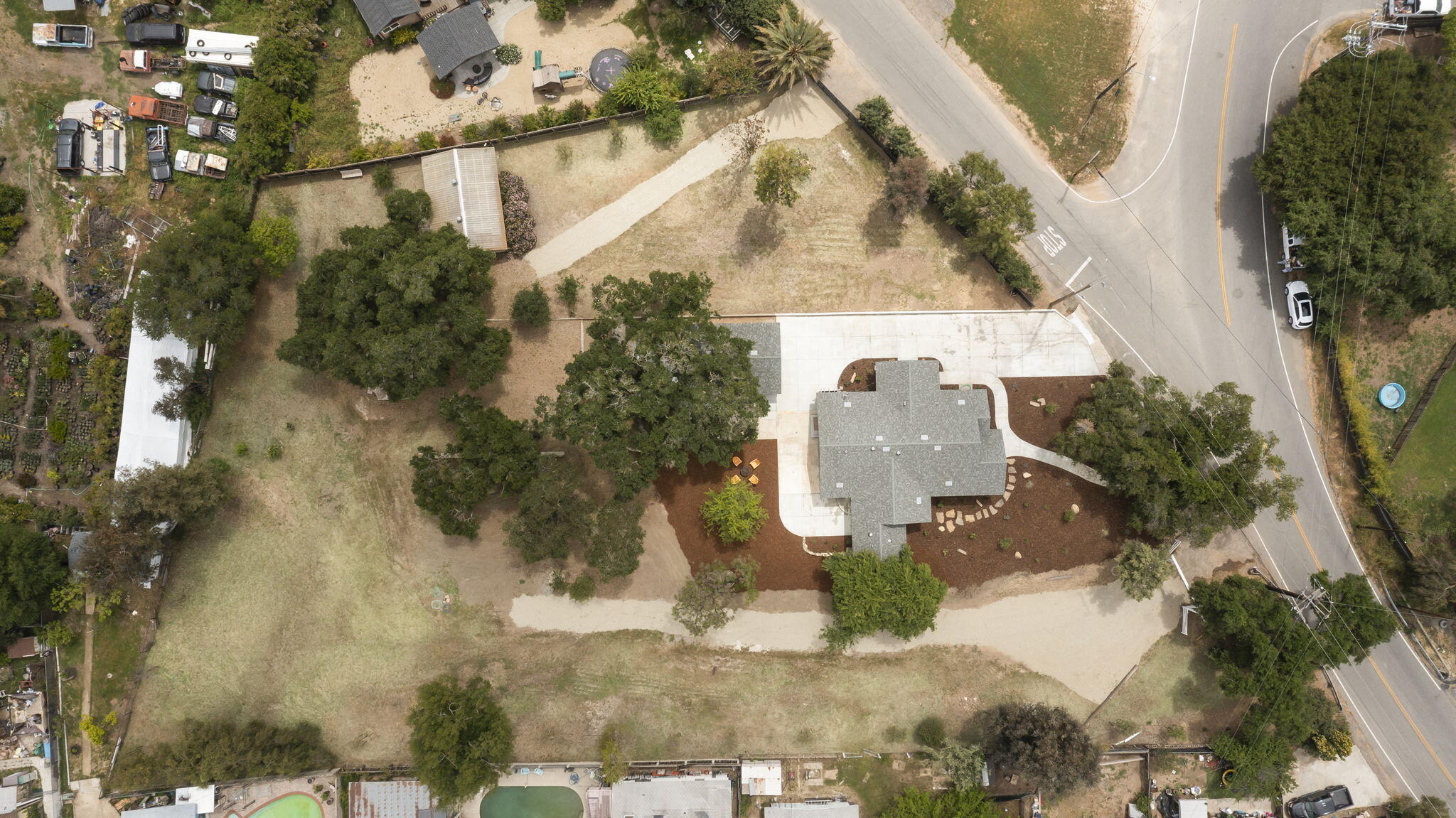 350 Old Grade Road Oak View, CA 93022 - Photo 53 of 59 a aerial view of a house with a yard and large trees