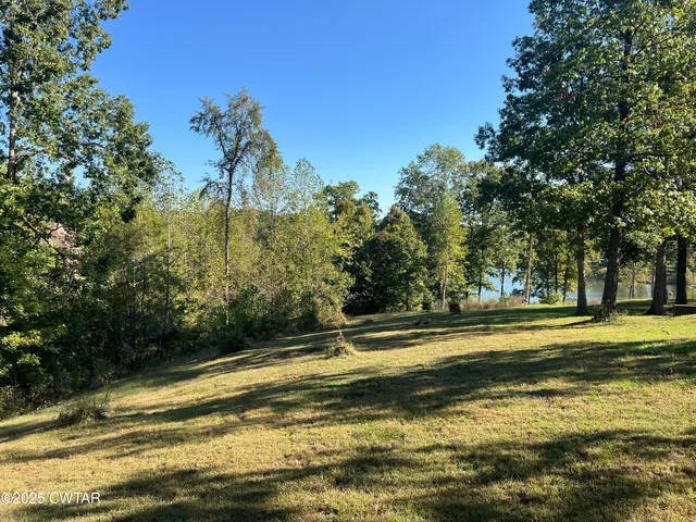 a view of a swimming pool with an outdoor space and seating area