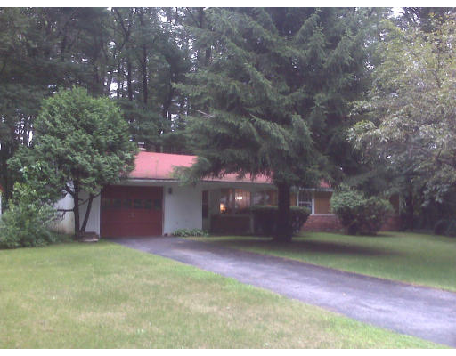 3 Santa Fe Road Chelmsford, MA 01824 - Photo 2 of 8 a front view of a house with a yard