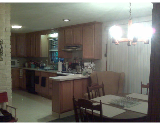 3 Santa Fe Road Chelmsford, MA 01824 - Photo 5 of 8 a kitchen with kitchen island granite countertop a sink cabinets and stainless steel appliances