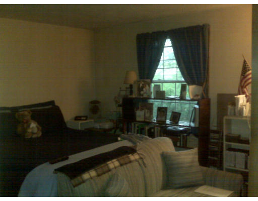 3 Santa Fe Road Chelmsford, MA 01824 - Photo 7 of 8 a living room with furniture a window and a fireplace