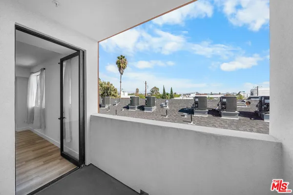a kitchen with kitchen island a sink a counter top space and cabinets