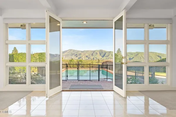 a view of an empty room and window