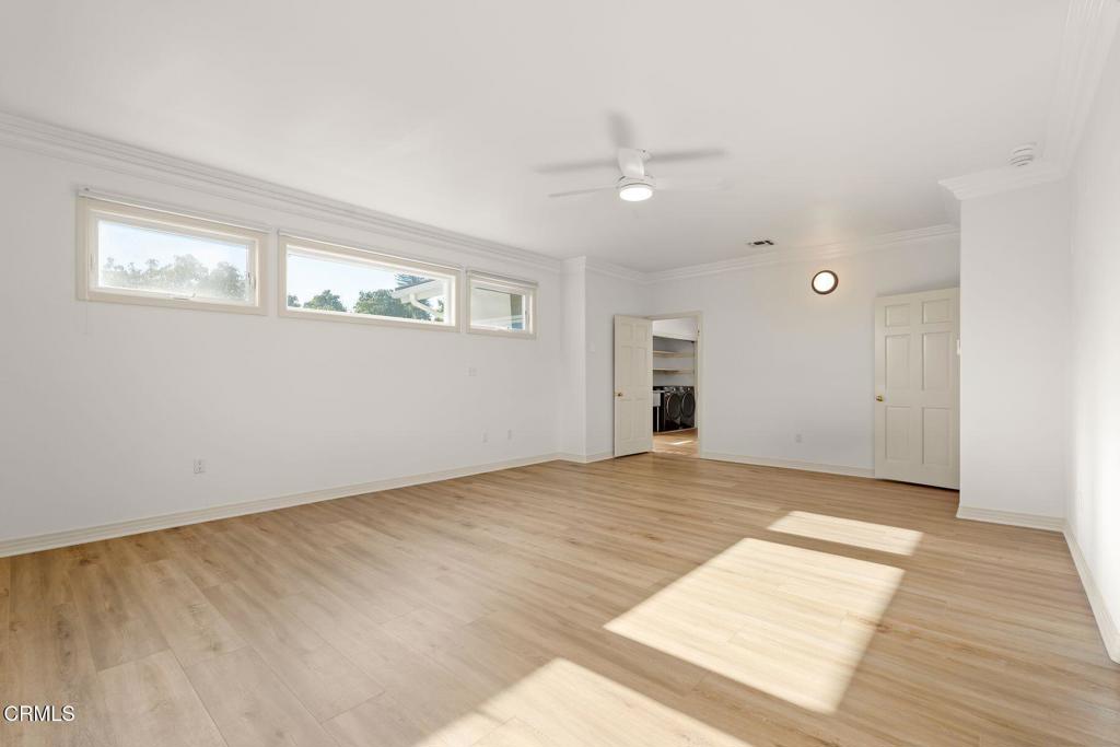 13922 Foothill Road Santa Paula, CA 93060 - Photo 14 of 36 a view of an empty room with wooden floor and a window