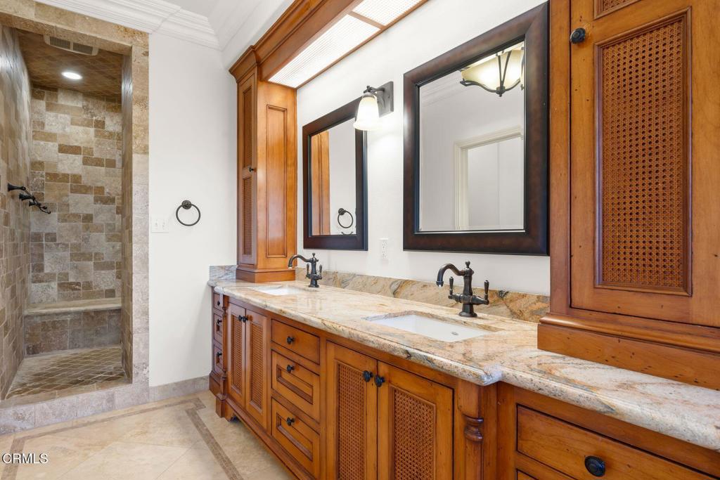 13922 Foothill Road Santa Paula, CA 93060 - Photo 16 of 36 a bathroom with a granite countertop sink and a mirror