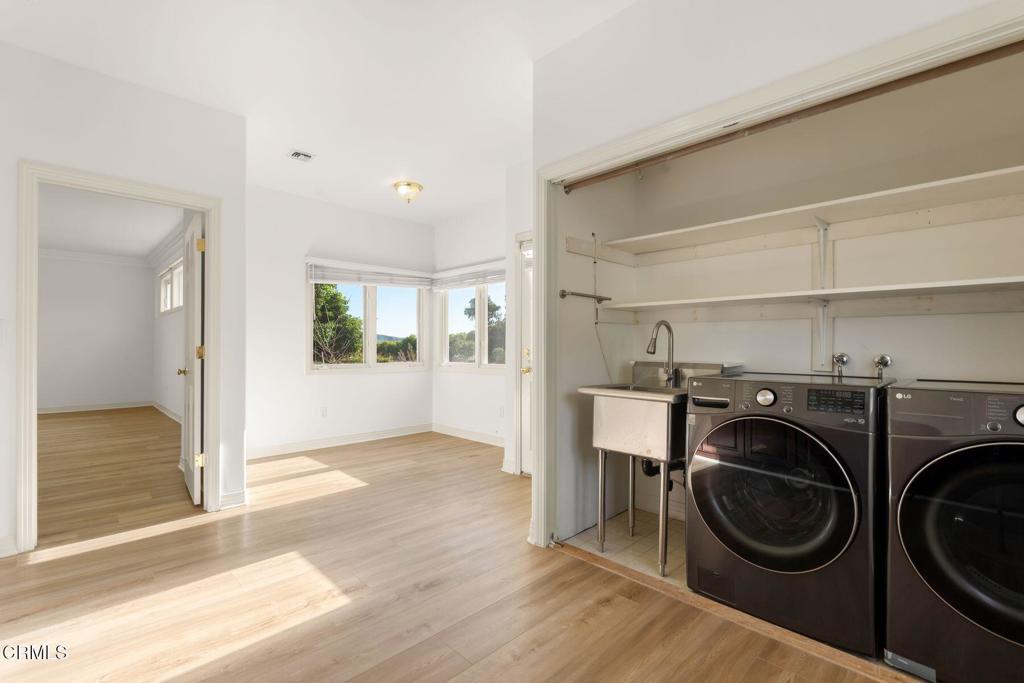 13922 Foothill Road Santa Paula, CA 93060 - Photo 21 of 36 a view of a hallway with washer and dryer
