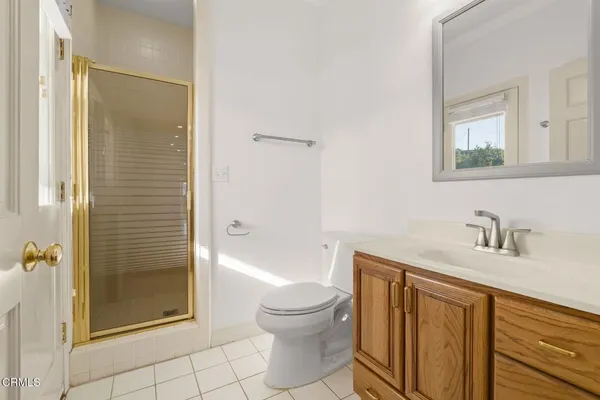 a bathroom with a sink toilet a shower and a mirror