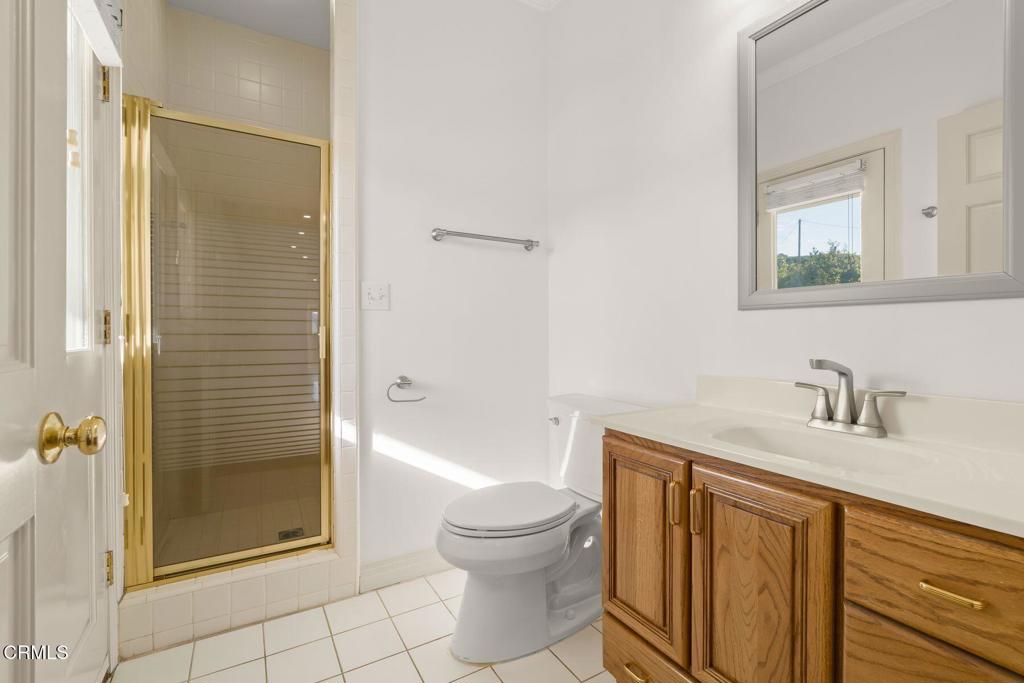 13922 Foothill Road Santa Paula, CA 93060 - Photo 23 of 36 a bathroom with a granite countertop sink toilet and shower