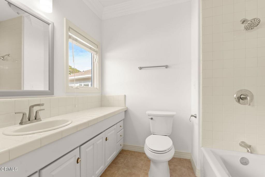 13922 Foothill Road Santa Paula, CA 93060 - Photo 25 of 36 a bathroom with a sink toilet a shower and a mirror