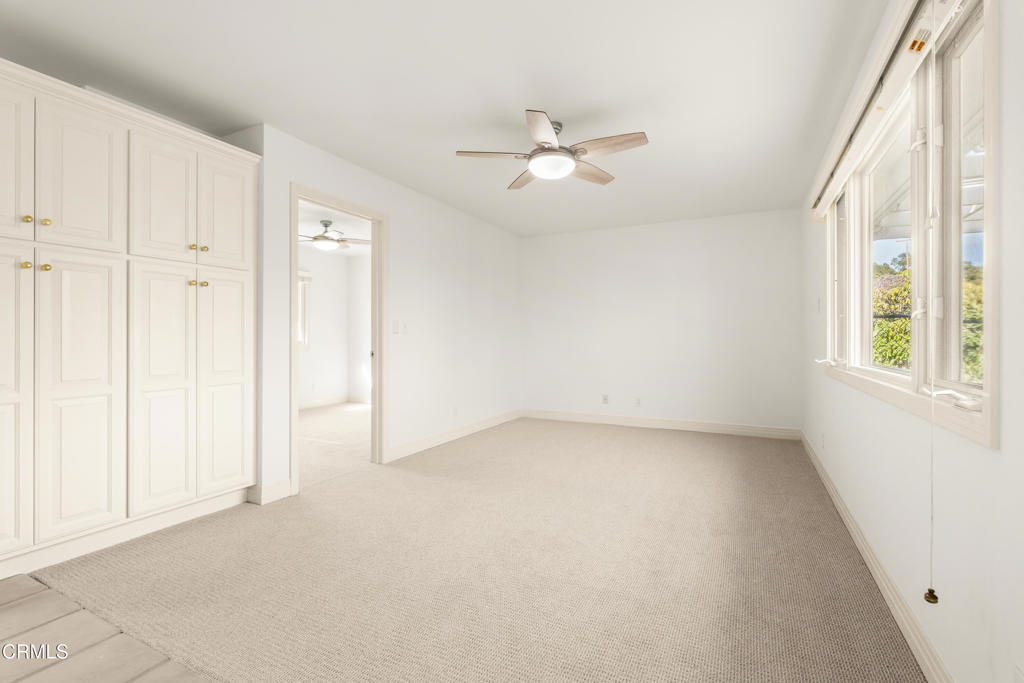 13922 Foothill Road Santa Paula, CA 93060 - Photo 31 of 36 an empty room with windows and fan