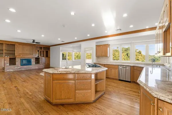 a kitchen with a stove a sink and a refrigerator