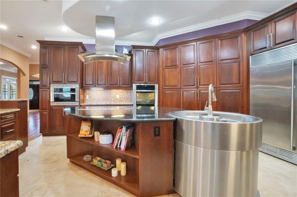 5785 Gilliam Road Orlando, FL 32818 - Photo 24 of 100 a kitchen with stainless steel appliances granite countertop a refrigerator and a stove