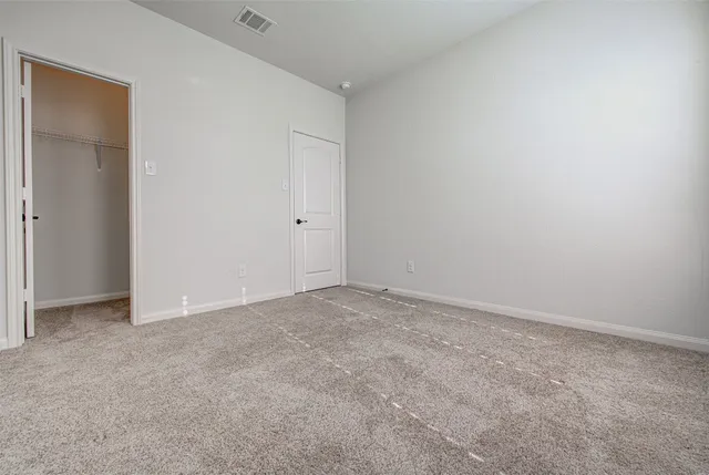 a view of an empty room and closet