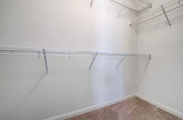 a view of a room with racks on the wall