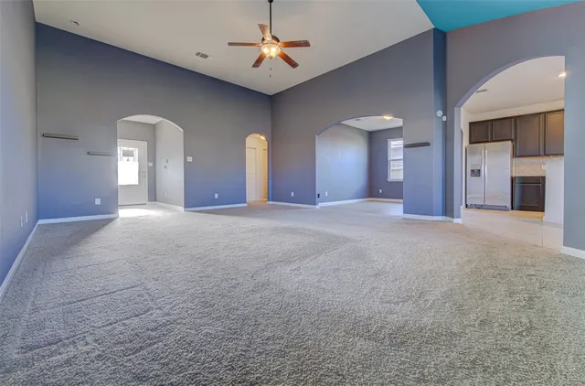 a view of a kitchen with a sink and a chandelier