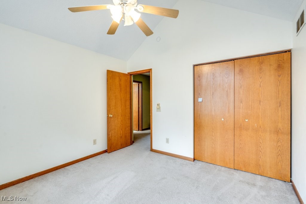 3362 Sunnybrook Road Kent, OH 44240 - Photo 25 of 50 Unfurnished bedroom with carpet flooring, high vaulted ceiling, a closet, and ceiling fan