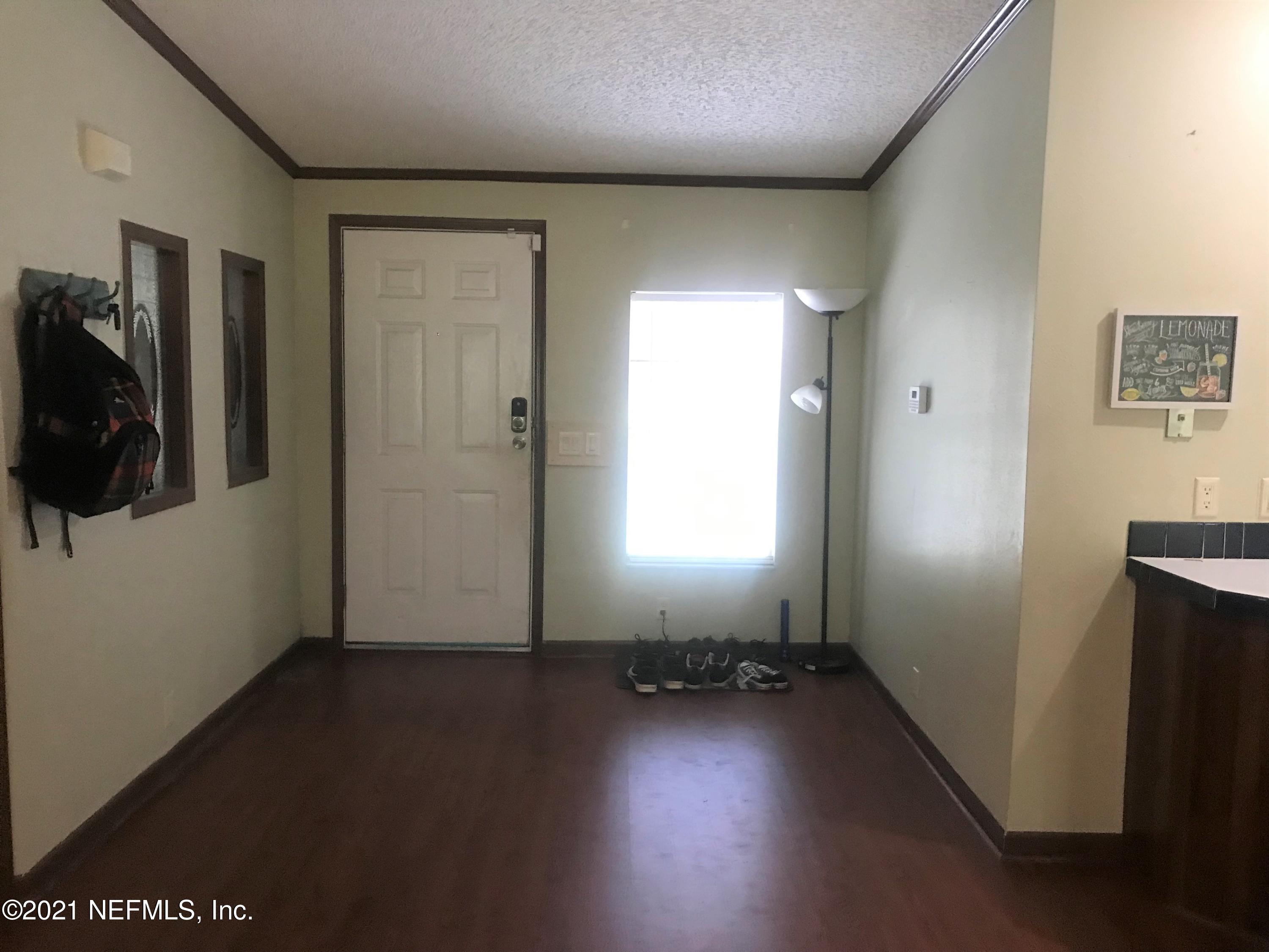 1860 Forbes Road St. Augustine, FL 32092 - Photo 5 of 24 an empty room with a door