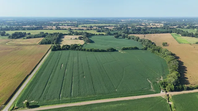 an aerial view of river residential houses with outdoor space and swimming pool