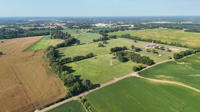 an aerial view of residential houses with outdoor space