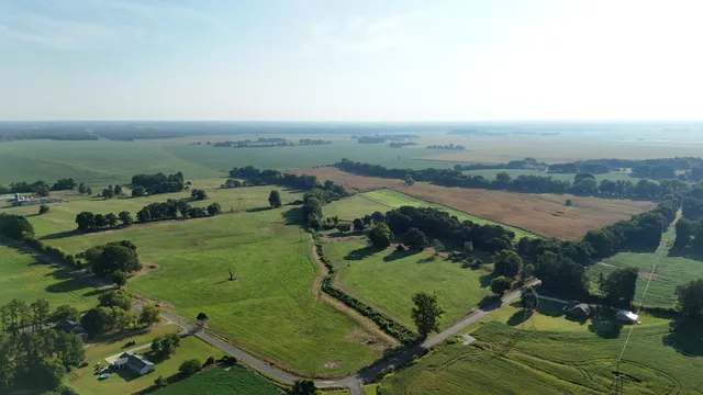 an aerial view of a residential houses with outdoor space