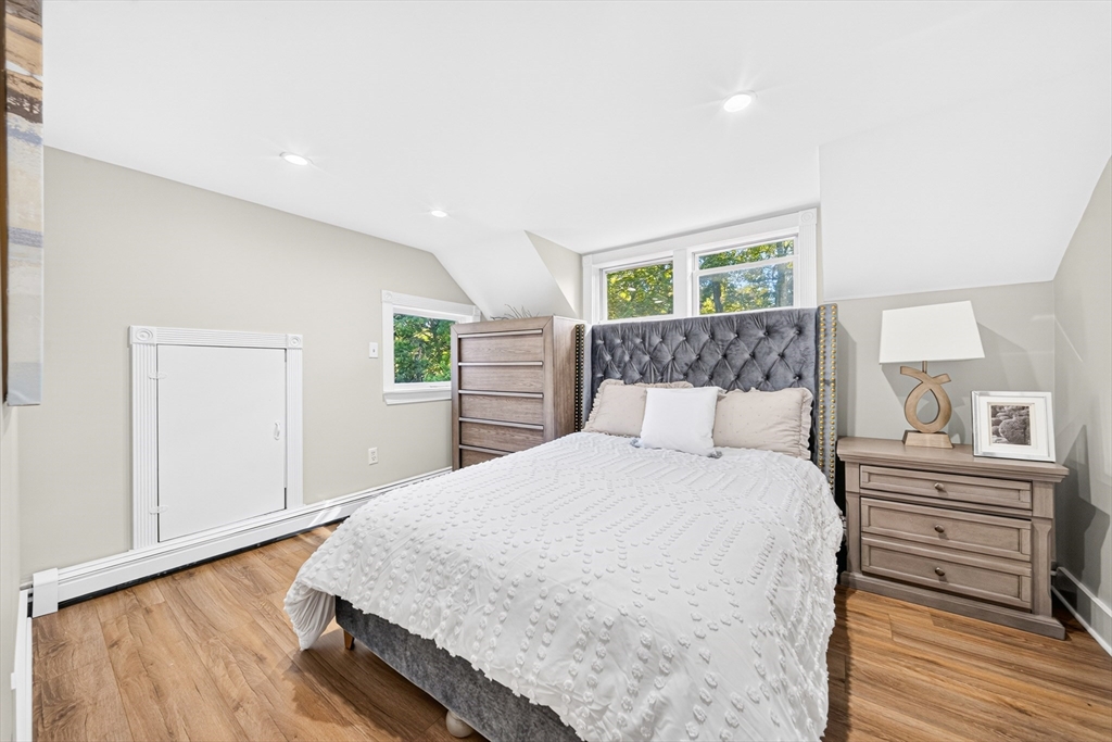 24 Miller Road Wilmington, MA 01887 - Photo 24 of 40 a bedroom with a bed and wooden floor