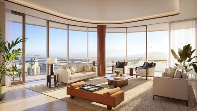 a living room with furniture and floor to ceiling windows