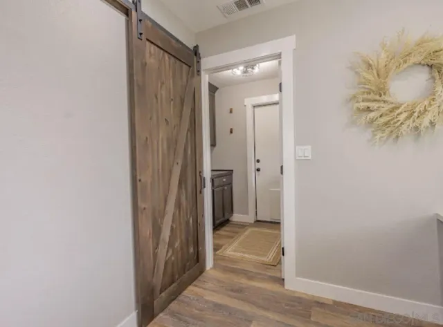 a spacious bedroom with a large bed and windows