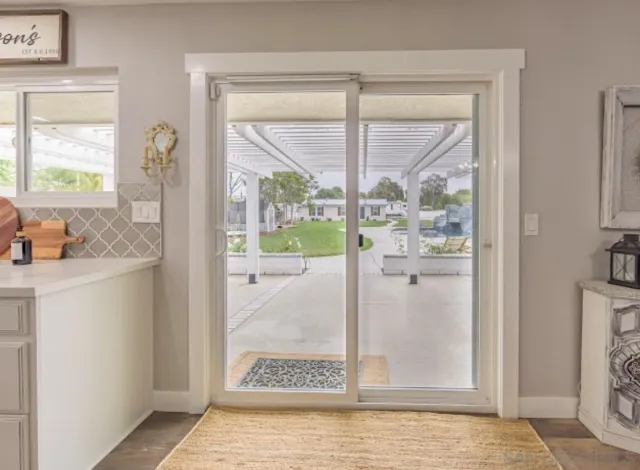 a view of a patio with chairs and a table