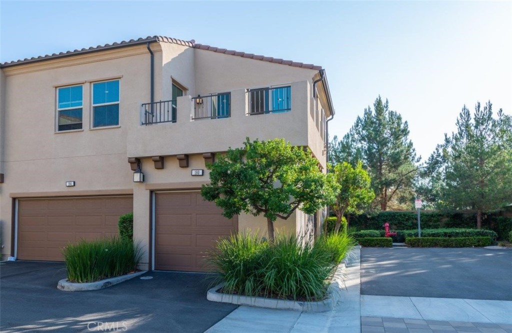 180 Borrego Irvine, CA 92618 - Photo 3 of 23 a front view of a house with plants