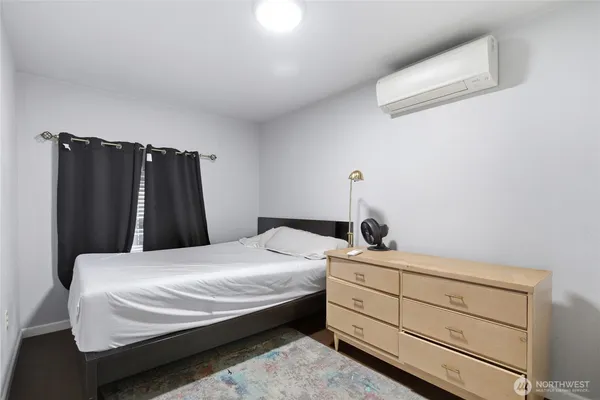 a bedroom with a bed and a closet