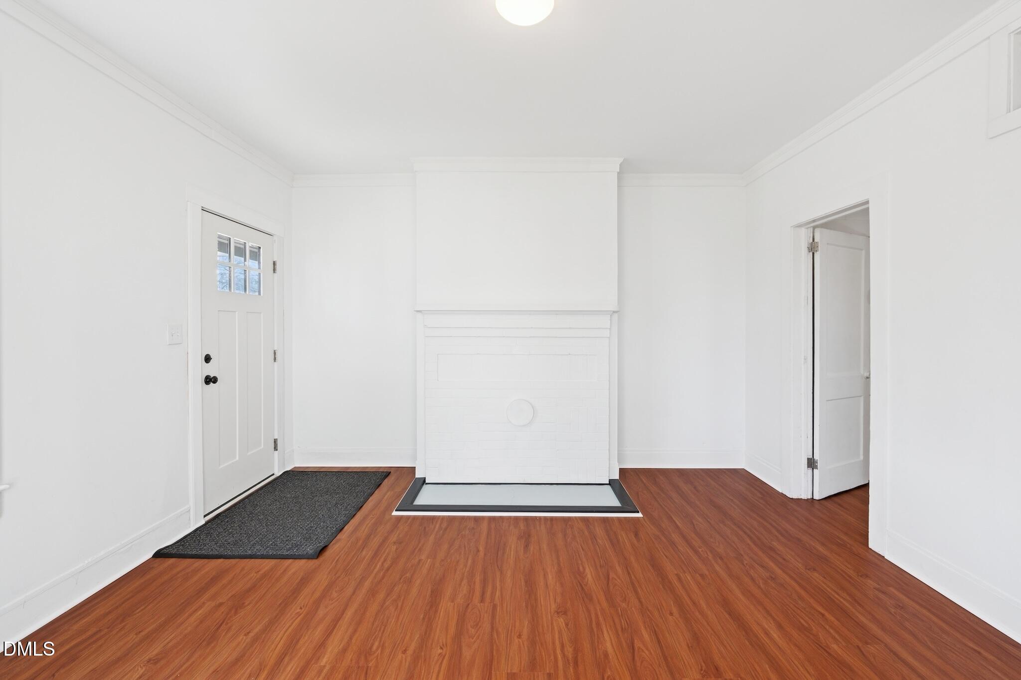 705 North Driver Street Durham, NC 27703 - Photo 11 of 46 an empty room with wooden floor