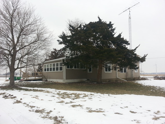 1453 Houghtby Road Shabbona, IL 60550 - Photo 1 of 22 a view of a house with a yard covered in snow