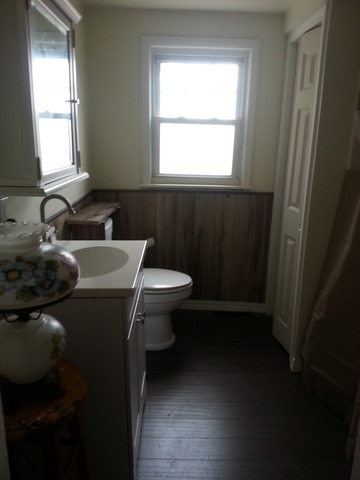 1453 Houghtby Road Shabbona, IL 60550 - Photo 18 of 22 a bathroom with a sink a toilet and a mirror