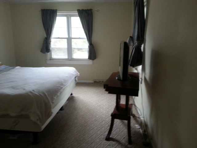 1453 Houghtby Road Shabbona, IL 60550 - Photo 19 of 22 a bedroom with a bed and a window