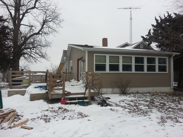 1453 Houghtby Road Shabbona, IL 60550 - Photo 2 of 22 a view of a house with a yard covered in snow