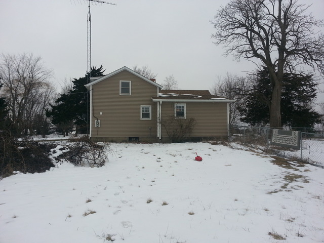 1453 Houghtby Road Shabbona, IL 60550 - Photo 4 of 22 a front view of a house with a yard