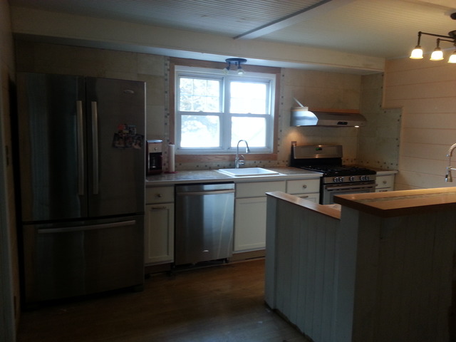 1453 Houghtby Road Shabbona, IL 60550 - Photo 7 of 22 a kitchen with a sink a stove a refrigerator and cabinets