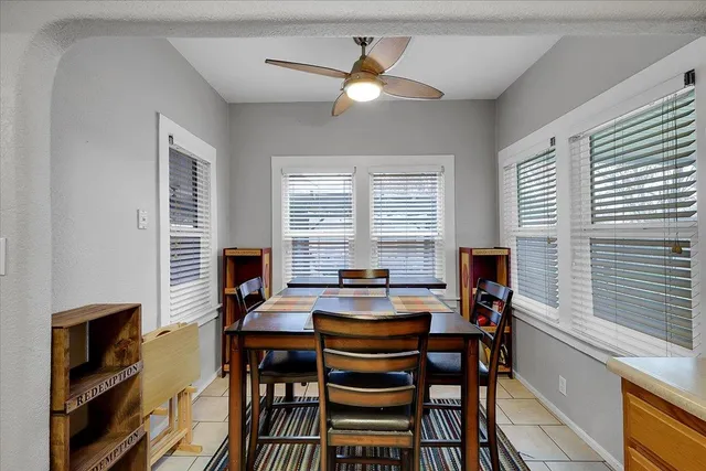 a dining room with furniture and window