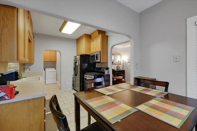 a bed room with a bed and a television