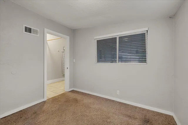 a view of empty room with windows
