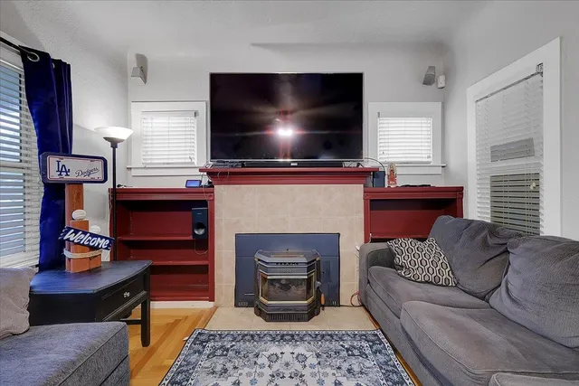 a living room with furniture and a fireplace