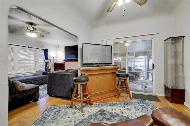 a living room with furniture a rug and a window