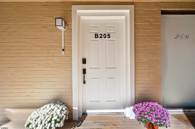 a bedroom with a bed and a wall painting