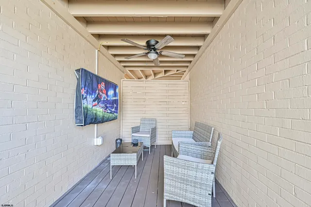 a view of a livingroom with furniture and wooden floor