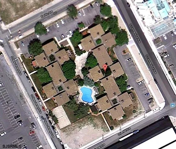 an aerial view of residential house with parking