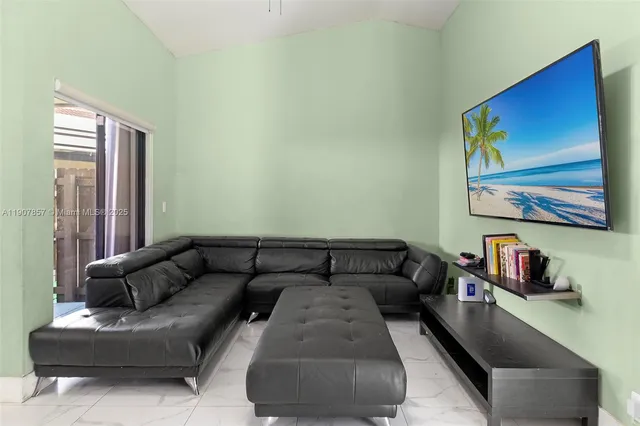 a living room with furniture and a couch