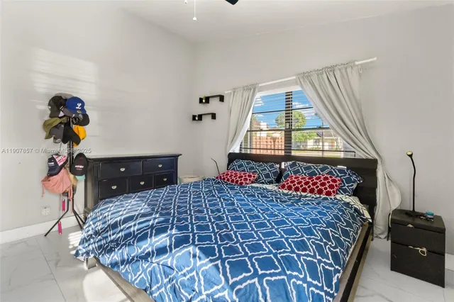 a bedroom with a bed and a dresser