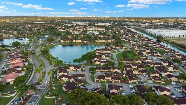 an aerial view of city and lake