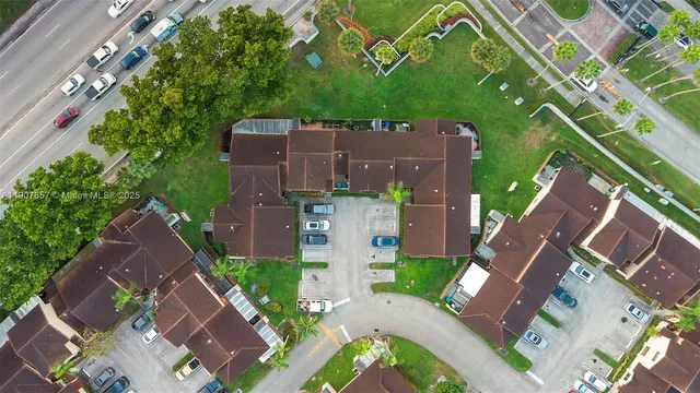 an aerial view of a house with a garden