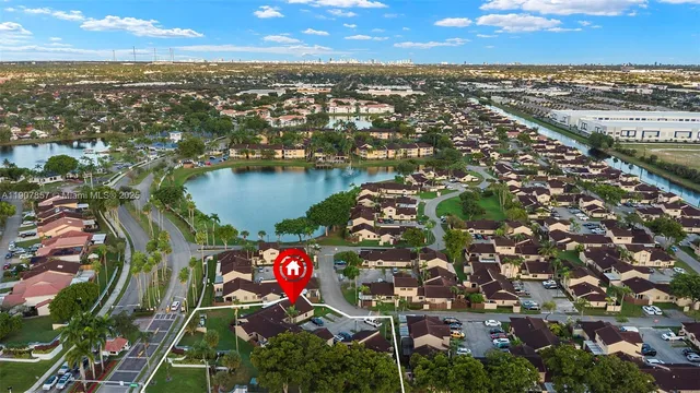 an aerial view of residential houses with outdoor space